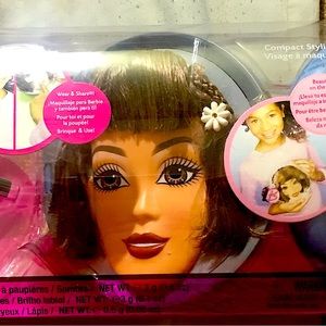 Barbie teaching little toddlers how to put make up on